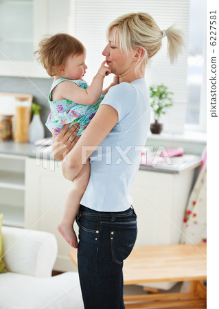 Young mother playing with her daughter Young mother playing with her daughter 6227581