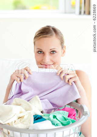 Cute young woman doing housework Cute young woman doing housework 6228669