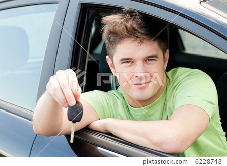 Animated caucasian man holding a car key Animated caucasian man holding a car key 6228748