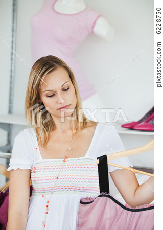 Cute women choosing new clothes Cute women choosing new clothes 6228750