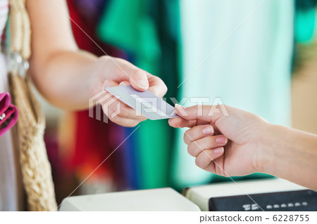 Close-up of a woman paying with her credit card 6228755
