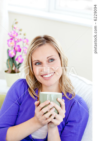 Charming woman holding cup 6229094