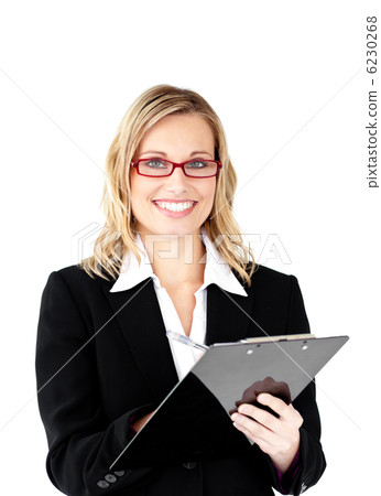 Confident businesswoman wearing glasses holding a clipboard smil Confident businesswoman wearing glasses holding a clipboard smil 6230268