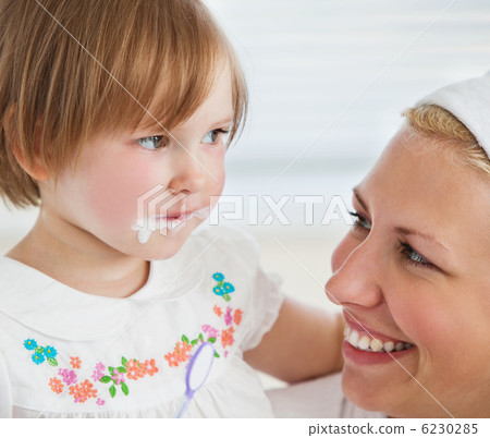 Caucasian cute girl brushing her teeth with her mother Caucasian cute girl brushing her teeth with her mother 6230285