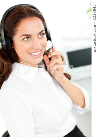 Bright woman wearing a headset Bright woman wearing a headset 6230843