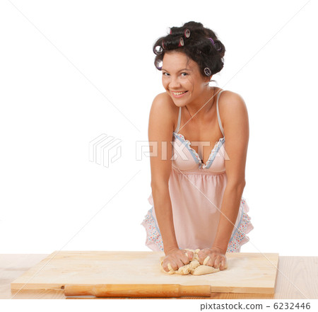 housewife mix dough on the wooden board. 6232446