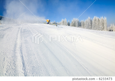 Snowmaking on a mountain ski resort 6233473