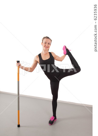 Athletic young woman with pole 6235936