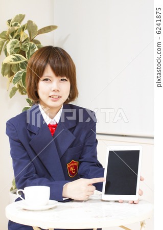 Female high school student who shows iPad mini 6241875