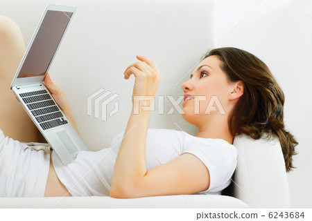 working in a laptop working in a laptop 6243684