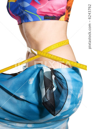 Woman measures waist 6243762