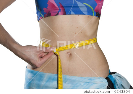Woman measures  waist 6243804