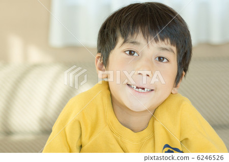 A boy with a tooth missing 6246526
