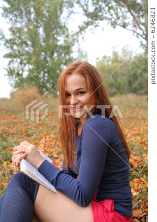 beautiful girl holding an open book beautiful girl holding an open book 6246821