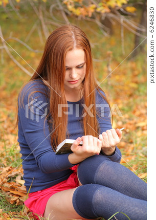 beautiful girl holding an open book 6246830