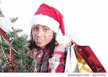 Young girl in Santa hat with gifts 6247332