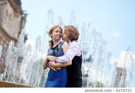 Young loving couple in Paris kissing near the fountain 6259722