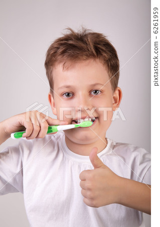 happy boy with toothbrush 6261959