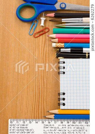 school supplies and checked notebook on wood school supplies and checked notebook on wood 6262279