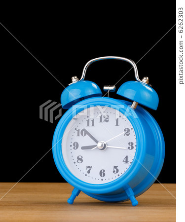 alarm clock watch  on wood 6262303