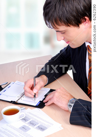 Mature bussinessman working Mature bussinessman working 6262390