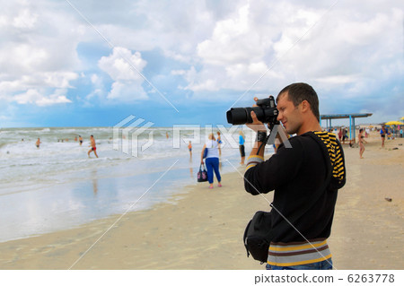 Man photographer takes shot Man photographer takes shot 6263778