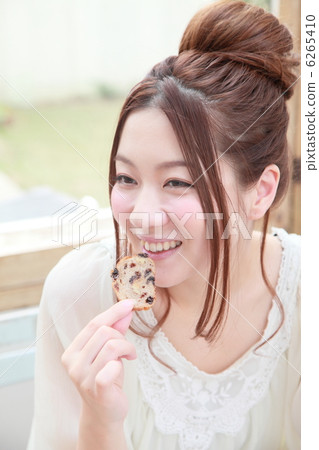A woman eating sweets A woman eating sweets 6265410