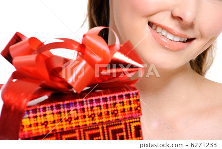 unrecognizable girl with a red present box on foreground 6271233