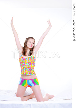Young pretty girl stretch oneself after wake-up 6271528