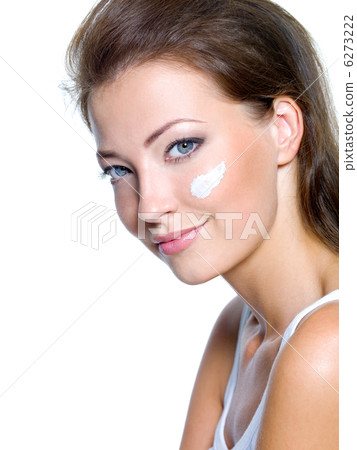 woman with moisturizer cosmetic cream on face woman with moisturizer cosmetic cream on face 6273222