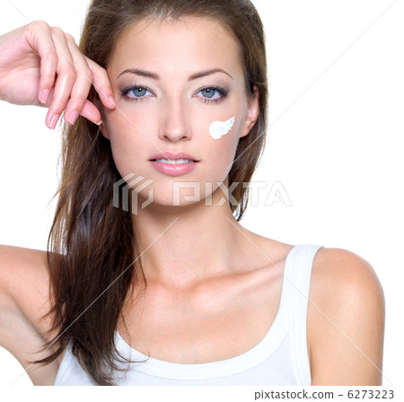 face of a young woman with cream on face face of a young woman with cream on face 6273223