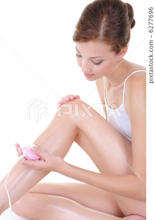 beautiful young woman shaving her legs beautiful young woman shaving her legs 6277696