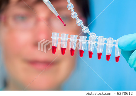Girl student holding a microtube Girl student holding a microtube 6278612