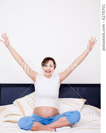 pregnant woman with raised hands 6278701