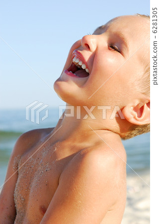 portrait of a laughing boy on the beach portrait of a laughing boy on the beach 6281305