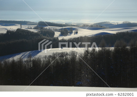 Hill landscape and sun pillar Hill landscape and sun pillar 6282001