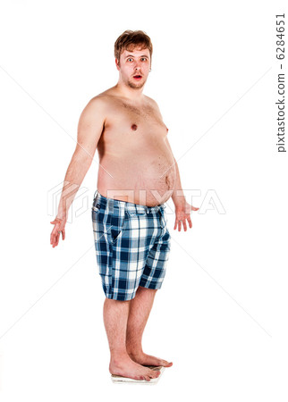 Overweight, fat man and scales. Overweight, fat man and scales. 6284651