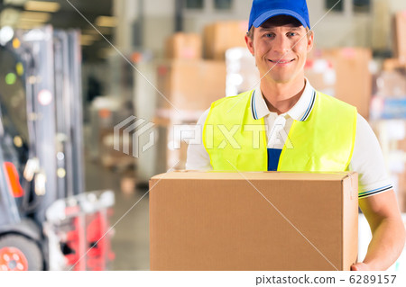 worker holds package in warehouse of forwarding 6289157