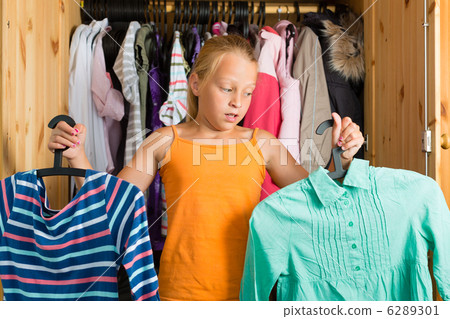 Family - child in front of her closet or wardrobe 6289301