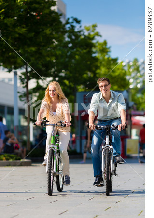 urban couple riding bike in free time in city 6289337