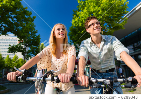urban couple riding bike in free time in city 6289343