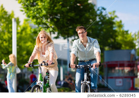 urban couple riding bike in free time in city 6289345