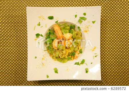 Hand-made tayarin angel with shrimp and fava beans with Bottarga 6289572