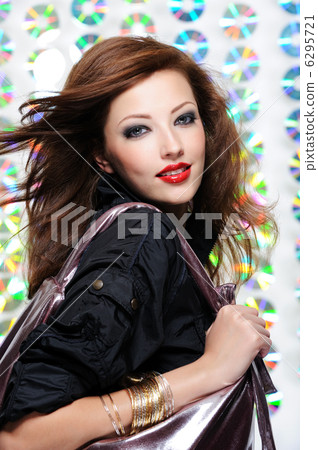 Beautiful modern woman holding shopping bag 6295721