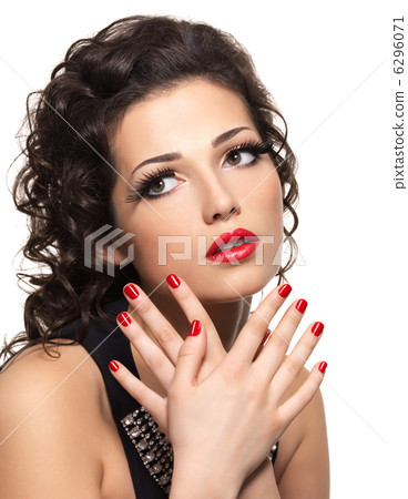 Beautiful fashion woman with red manicure and lips Beautiful fashion woman with red manicure and lips 6296071