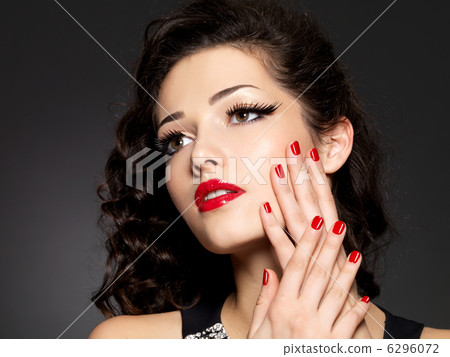 Beauty fashion woman with red nails and makeup Beauty fashion woman with red nails and makeup 6296072