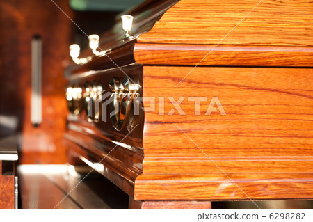 Funeral with coffin in hearse 6298282