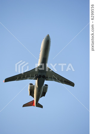 A jet airplane flying into the sky 6299556