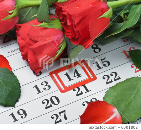 roses lay on the calendar with the date of February 14 Valentin 6301802
