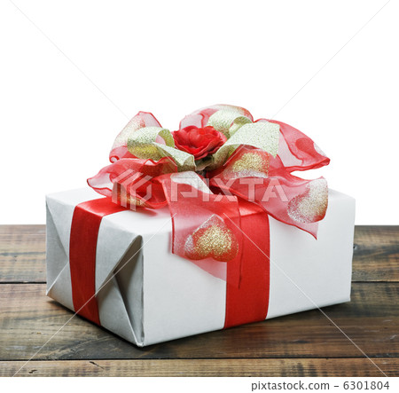 White gift box with red ribbon bow 6301804